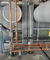 Copper Pipes and Valves in Industrial Plumbing Setup